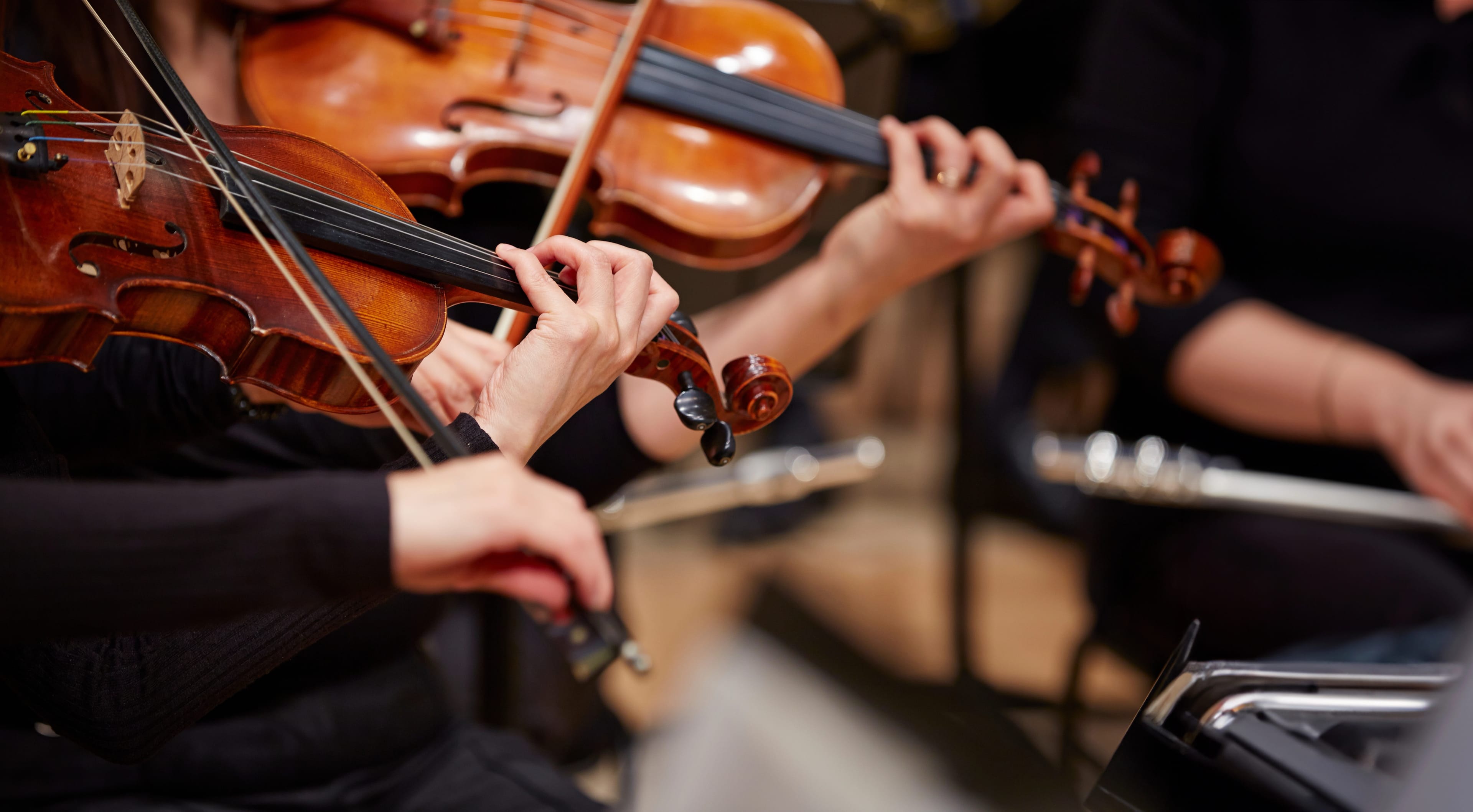 Close,Up,Of,Musician,Hands,Playing,Violin