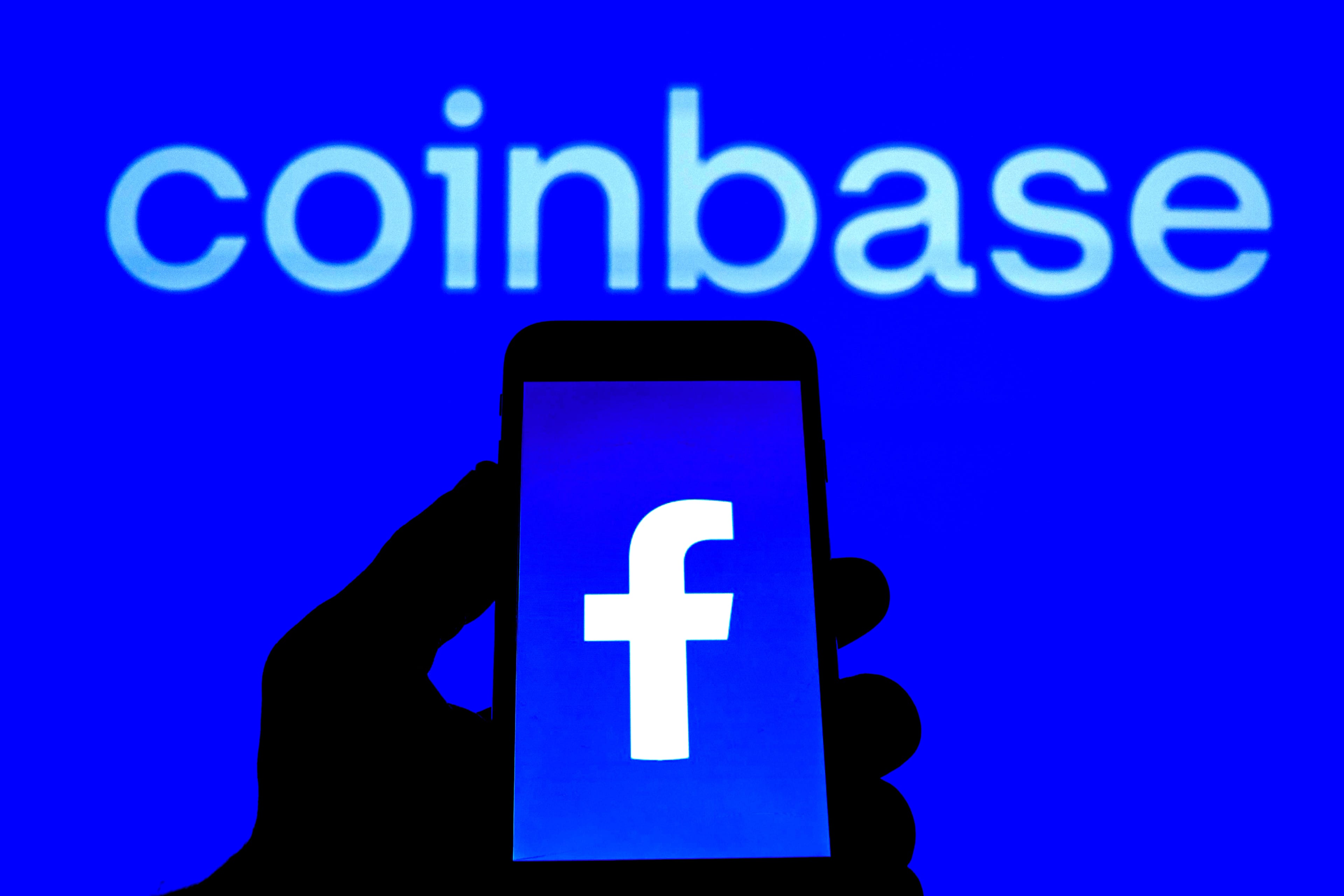 Logos seen displayed on a smartphone with a Coinbase logo in the background - 12 Jan 2022
