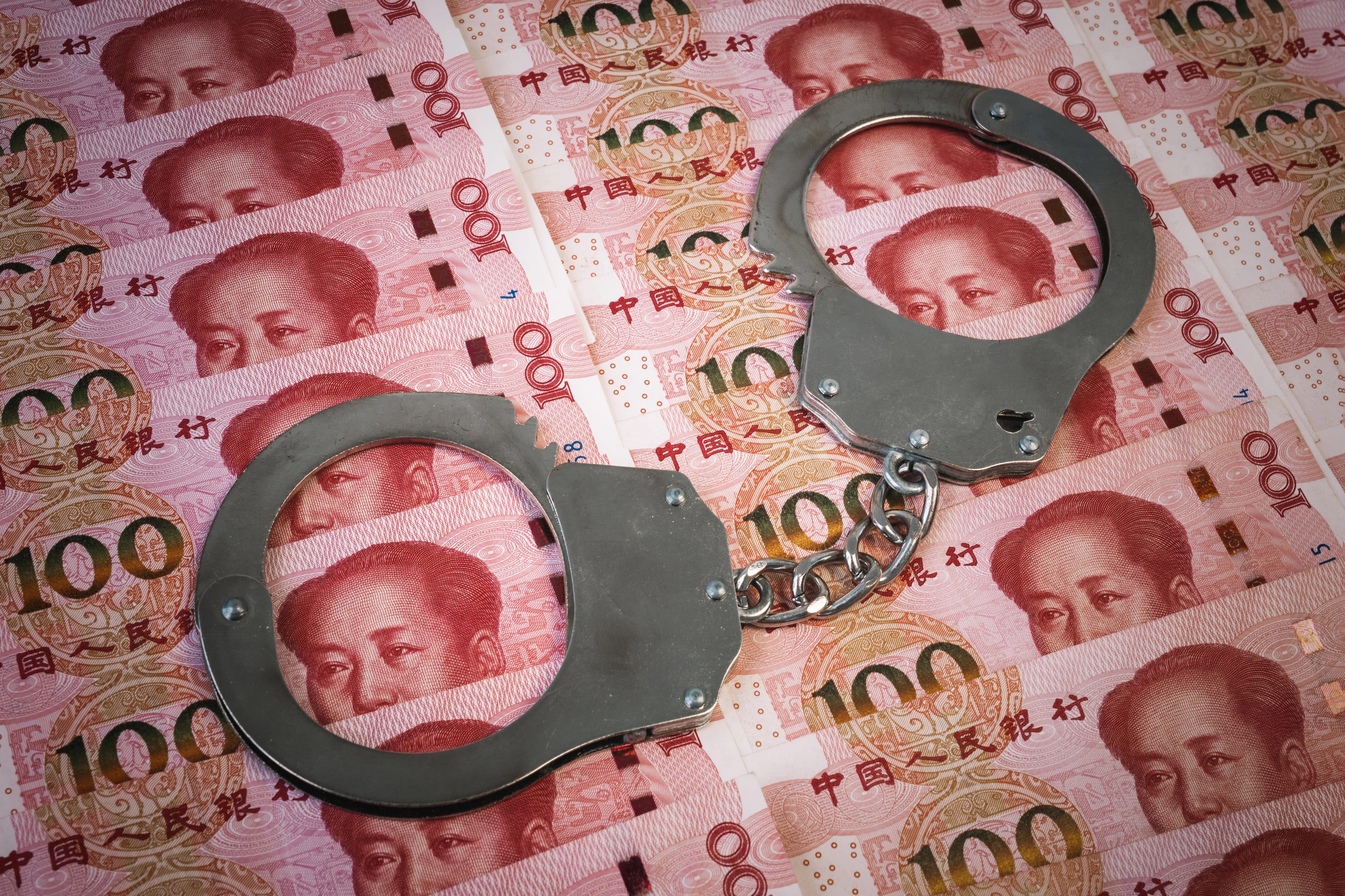 Bribe,,Corruption,And,Money,Laundering,With,Handcuffs,On,Banknotes,And
