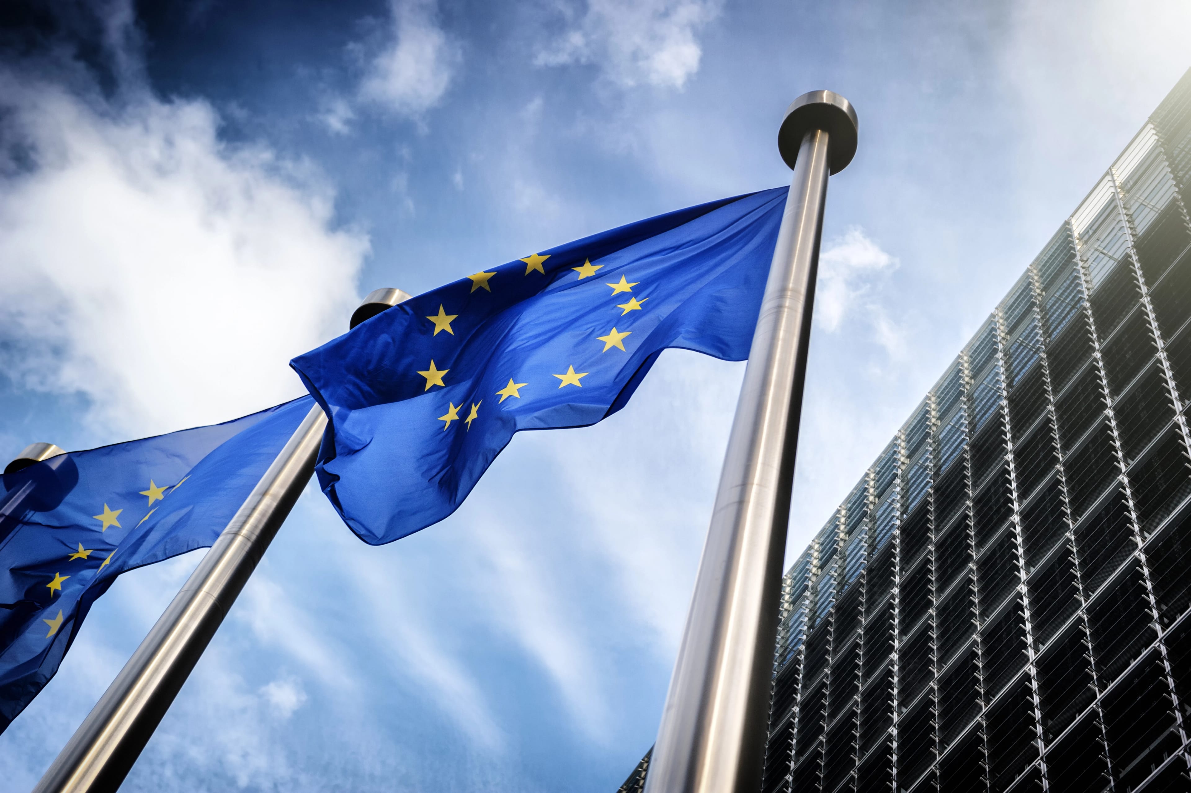 European,Union,Flags,On,Blue,Sky,Background
