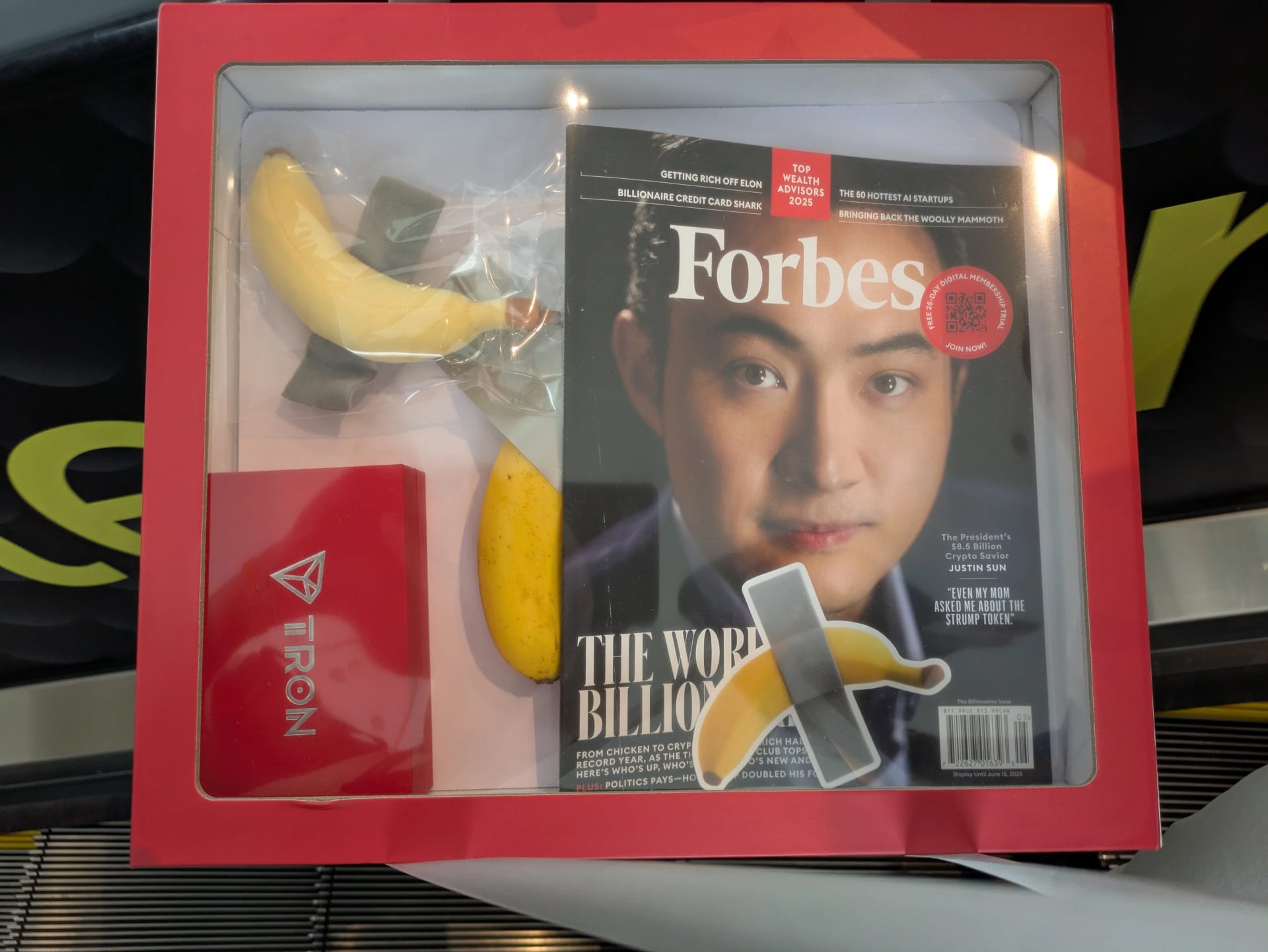 Justin Sun, the founder of TRON, dished out a copy of his Forbes cover story with a banana, referencing his purchase of Maurizio Cattelan’s work, Comedian. Source: DL News.