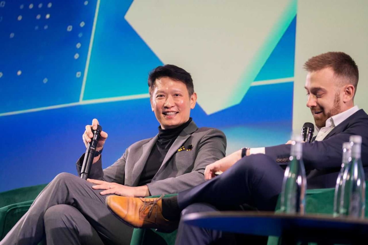A photo of Richard Teng and Leo Schwartz in a conference.